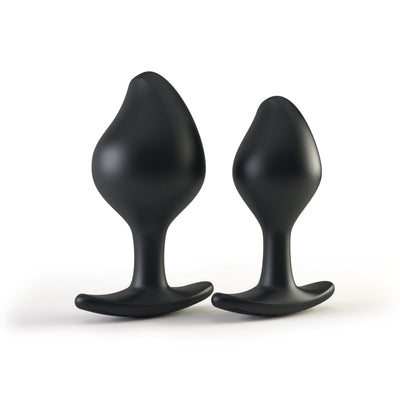 Two black silicone anal plugs with tapered tips and flared bases, designed for comfortable and safe use.