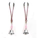 Adjustable pink metal nipple clamps with silver bells and pink beads on a white background.