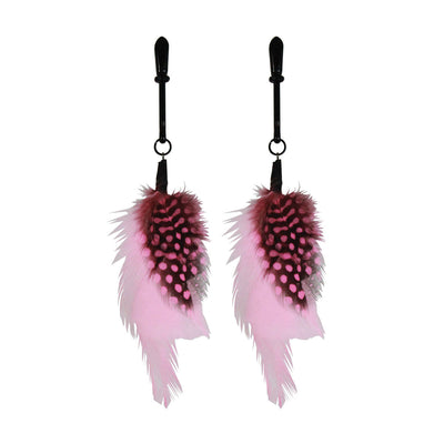 Pair of black nipple clamps adorned with soft pink and black spotted feathers for a playful touch.