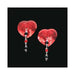 Red sequin heart-shaped pasties with dangling black and red faceted beads on a black background