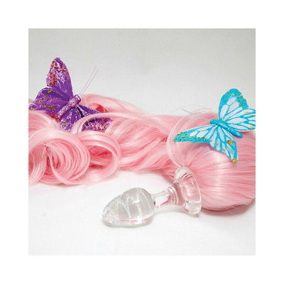 Clear glass anal plug with attached long curly pink ponytail and decorative purple and blue butterflies.