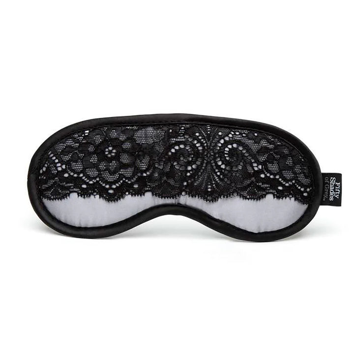 Black lace and silver satin blindfold from Fifty Shades of Grey Play Nice collection with soft padded edges.
