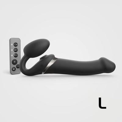 Large black bendable strap-on with ergonomic design and remote control for customizable multi-motor stimulation.
