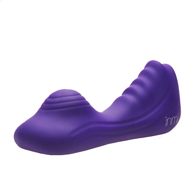 Purple silicone vibrating grinder with textured ridges and ergonomic design for versatile stimulation.