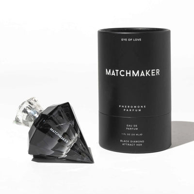 Eye of Love Matchmaker Black Diamond pheromone perfume in a black diamond-shaped bottle with matching black cylindrical packaging.