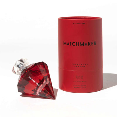 Red diamond-shaped Matchmaker pheromone parfum bottle with matching red cylindrical packaging on white background.