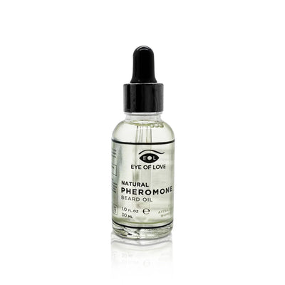 Clear glass dropper bottle of Eye of Love Natural Pheromone Beard Oil 30ml with black cap on white background.
