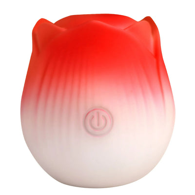 Red and white rose-shaped pulsing stimulator with power button on front, made of smooth silicone.