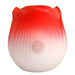 Red and white rose-shaped pulsing stimulator with power button on front, made of smooth silicone.