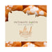 Intimate Earth Salted Caramel oral pleasure glide label with caramel and sea salt background.