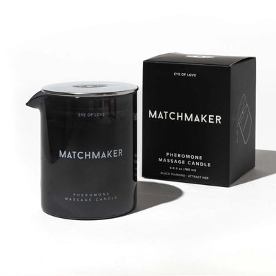 Eye of Love Matchmaker pheromone massage candle in black glass jar with matching black box packaging.