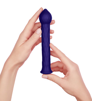 Hands holding a dark blue textured silicone wand with a pointed tip and flared base.