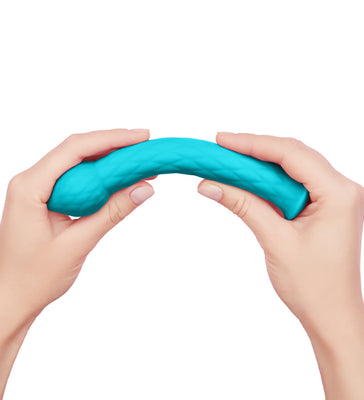 Hands bending a textured turquoise silicone wand designed for targeted stimulation and flexibility.