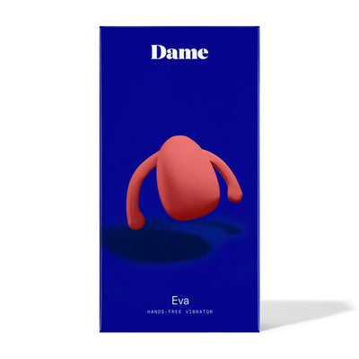 Packaging of Dame Eva hands-free vibrator in blue box with image of the coral-colored wearable device on front.
