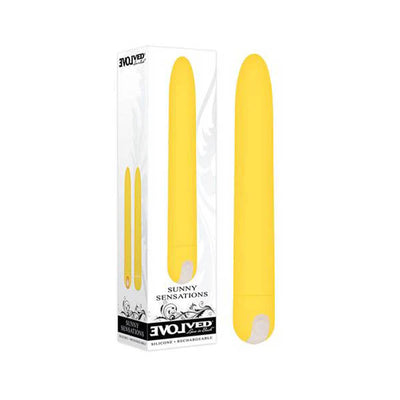 Yellow rechargeable silicone vibrator with a smooth, straight design next to its white and black Evolved Sunny Sensations packaging.