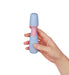 Hand holding a compact blue and pink Femme Funn Ffix Mini Wand vibrator against a white background.