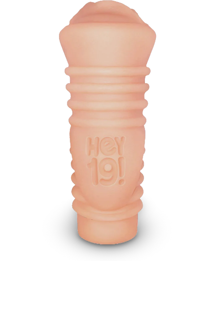 Compact flesh-toned vibrating stroker with textured grip and Hey 19! logo embossed on the side