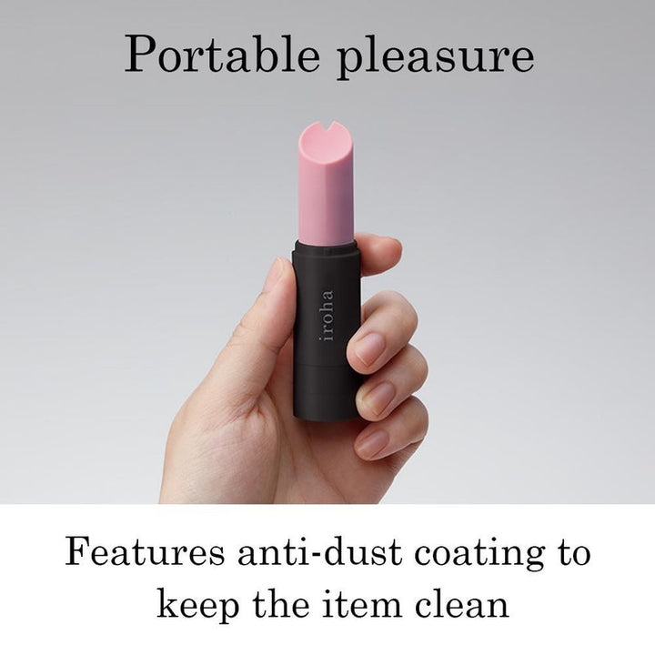 Hand holding a compact iroha Stick personal massager with anti-dust coating against a gray background.