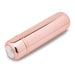 Rose gold compact bullet vibrator with smooth, sleek design and magnetic USB charging port on white background.