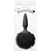 Black silicone butt plug with a large fluffy black faux fur bunny tail in retail packaging.