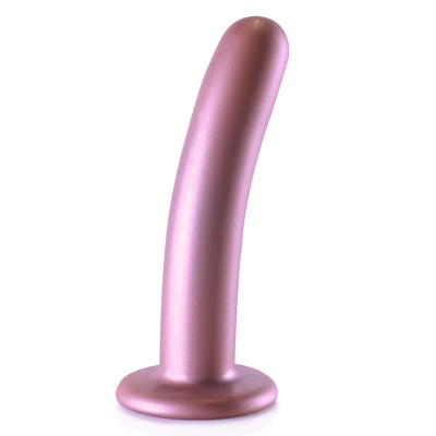 Rose gold smooth silicone G-spot dildo with curved shape and suction cup base standing upright on white background.
