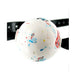 Close-up of a multicolored edible jawbreaker ball gag with adjustable black leather straps.