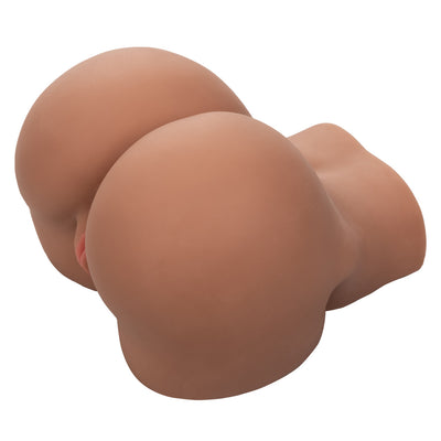 Brown realistic textured stroker toy shaped like a rounded buttocks with soft pink lips detail.