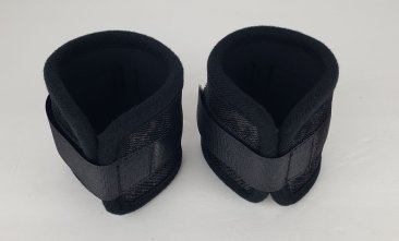 Pair of black neoprene wrist restraints with adjustable Velcro straps and lobster clasps for secure fit and comfort.