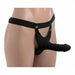 Black hollow silicone dildo strap-on with adjustable nylon harness displayed on a mannequin torso.