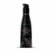Black bottle of Wicked Pink Lemonade flavored water-based intimate lubricant with a pump dispenser and pink text design.