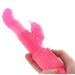 Hand holding a bright pink rotating rabbit vibrator with curved shaft and clitoral stimulator.