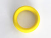 Bright yellow flexible cock ring with smooth surface, designed for comfortable and secure wear.