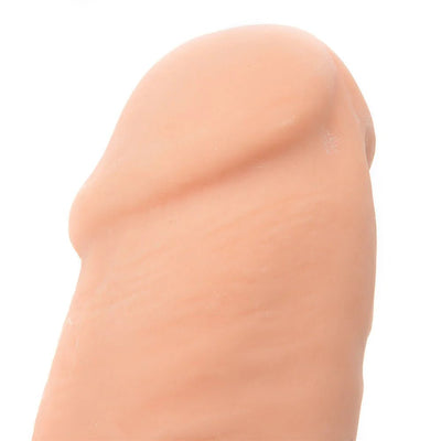 Close-up of the beige Adam & Eve Adams Colossal 12-inch dildo tip showing realistic texture and sculpted details.