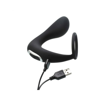 Black rechargeable prostate stimulator with attached stretchy C-ring and USB charging cable on white background.