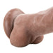 Close-up of the brown Adam & Eve Adams True Feel dildo with suction cup base and textured details.