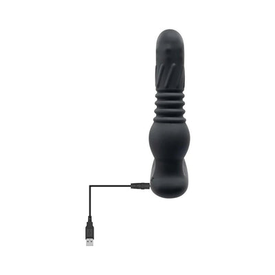 Black silicone prostate massager with textured shaft and USB charging cable attached.