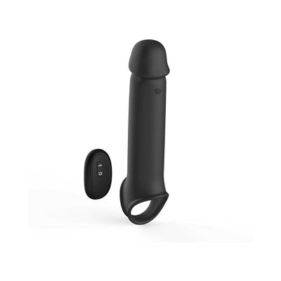 Black silicone vibrating extension with remote control and adjustable ball strap base.