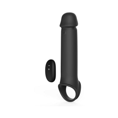 Black silicone vibrating extension with remote control, designed for added length and girth with a secure ball strap.