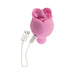 Pink rose-shaped silicone vibrator with USB charging cable on white background.
