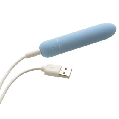 Light blue rechargeable bullet vibrator with USB charging cable on a white background.
