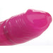 Close-up of the glossy pink slim vibrator tip with textured detailing.
