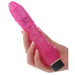 Hand holding a slim, textured pink vibrator with adjustable black dial base.