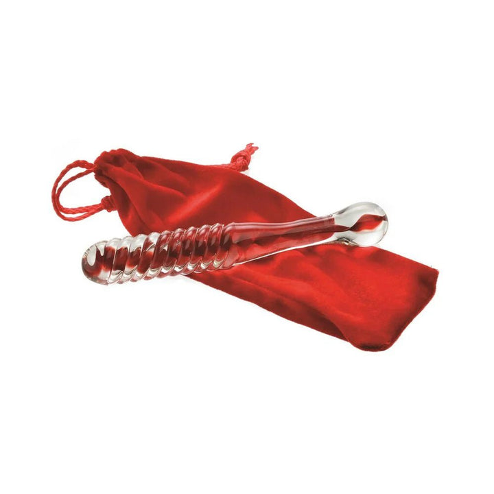 Clear glass dildo with raised swirl texture resting on a red velvet drawstring pouch.