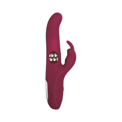 Deep red silicone rabbit vibrator with rotating beads and curved clitoral stimulator, designed for dual stimulation.