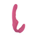 Pink silicone strapless strap-on with curved shaft and textured base for dual stimulation, designed for hands-free use.