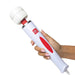 Hand holding Adam & Eve Magic Massager Deluxe with white flexible head and red control buttons on white background.