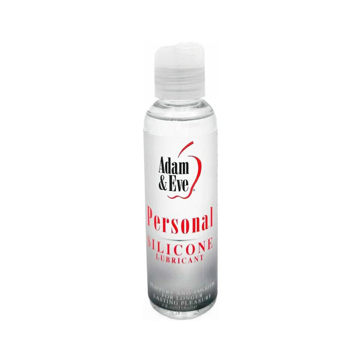 Clear 4 oz. bottle of Adam & Eve Personal Silicone Lubricant with white and red label and flip-top cap.