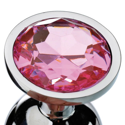 Medium-sized polished metal anal plug with a faceted pink gem at the base for a stylish finish.