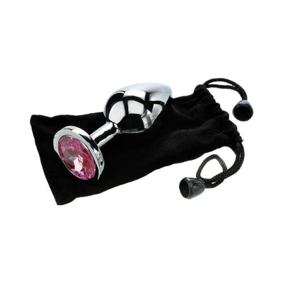 Medium-sized polished metal anal plug with a pink gem base resting on a black velvet drawstring pouch.