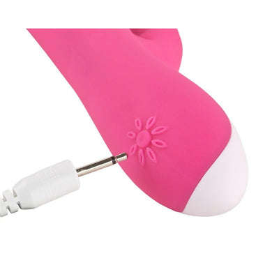 Close-up of pink Adam & Eve Warming Rabbit G vibrator with white charging port and floral power button detail.